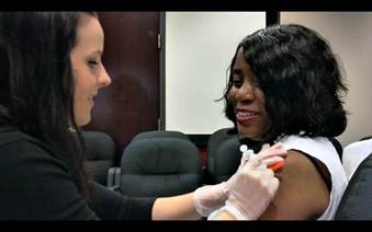 Female employee getting a flu shot