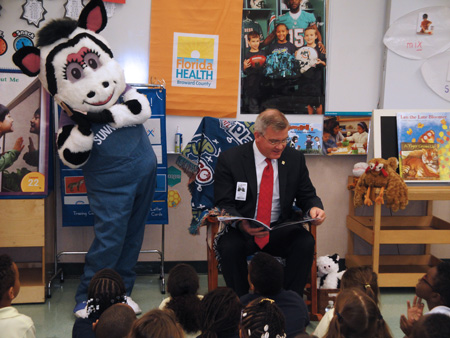 Dr. John Armstrong reading a book to students during Celebrate Literacy Week 2015.