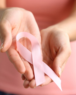 Hands holding breast cancer ribbon