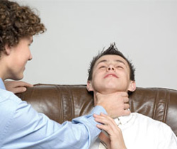 Two teenaged boys, one choking the other