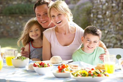 Family eating together outside