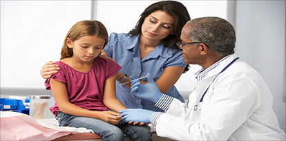 Young girl getting a shot