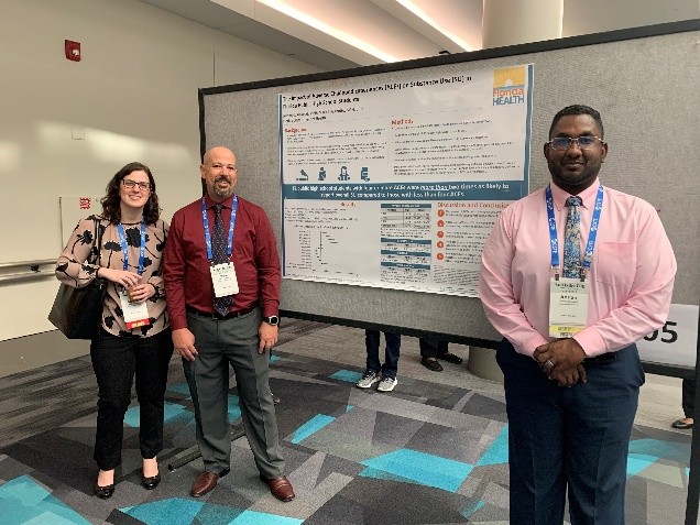 FL EIS Fellows presenting a poster at a conference