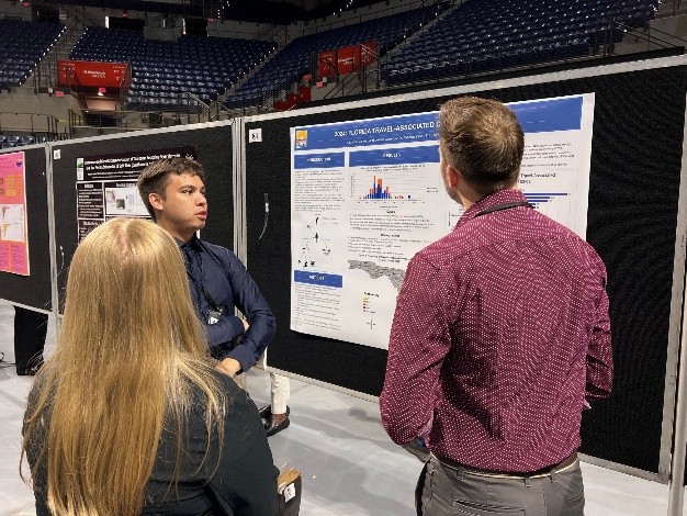 FL EIS Fellow presenting a poster at a research day