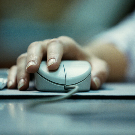 person clicking on computer mouse