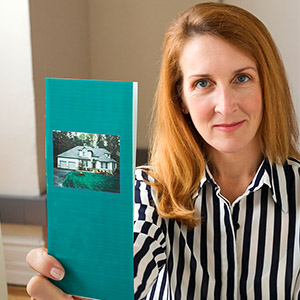 Well Owners Guide woman holding brochure in hand