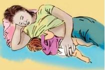 Woman breastfeeding using the Side-Lying Hold