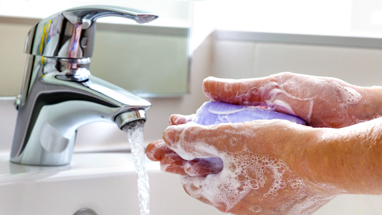 person washing their hands