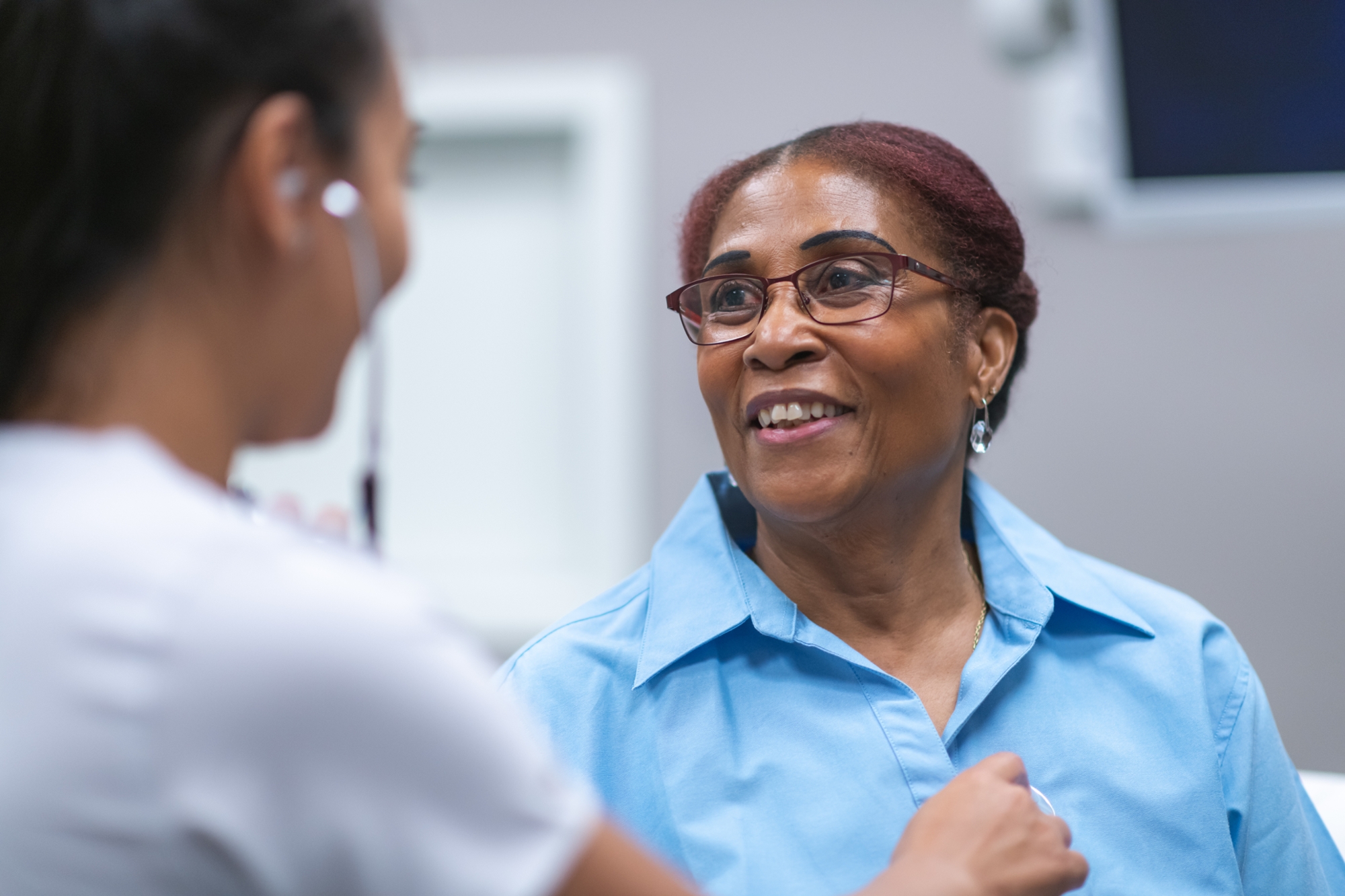 a woman aged 50–64 getting a free or low-cost breast or cervical cancer screenings; to stay healthy