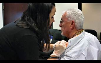 Male employee getting a flu shot