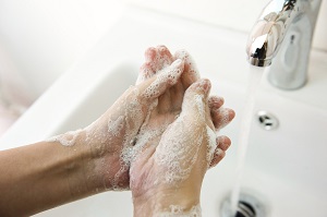 Soapy hands being washed