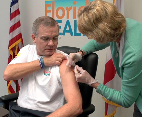 Dr. John Armstrong receiving a flu shot.