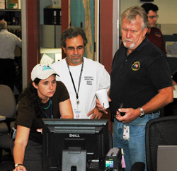 DOH Emergency Support Function staff looking at a computer