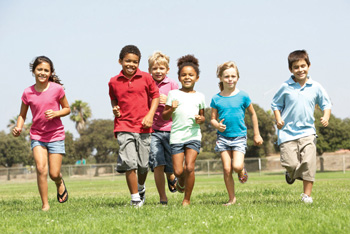 Kids running through a field