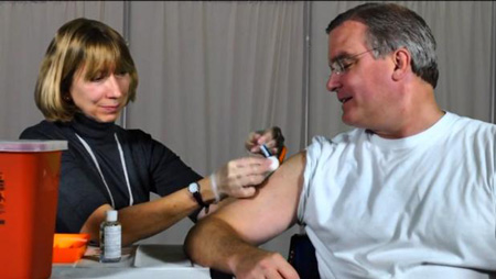 State Surgeon General John Armstrong receiving his flu shot