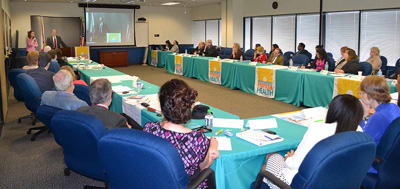 DOH and CDC Tuberculosis Partnership meeting photo. Image of attendees around the conference tables.