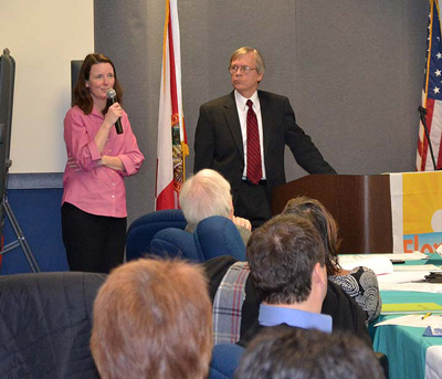 DOH and CDC Tuberculosis Partnership meeting photo. Image of two attendees speaking to the group.