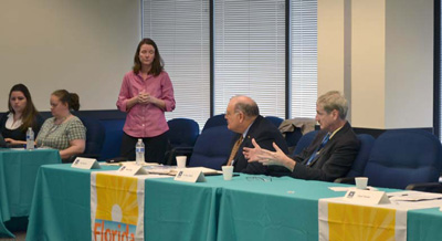 DOH and CDC Tuberculosis Partnership meeting photo. Image of an attendee at a table addressing the group.