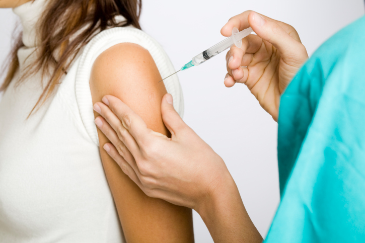 Picture of nurse giving a flu shot.