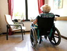 woman in wheelchair looking outside