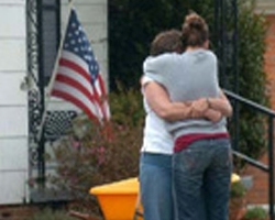 two women hugging after disaster