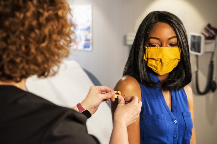 Black woman gets vaccine.