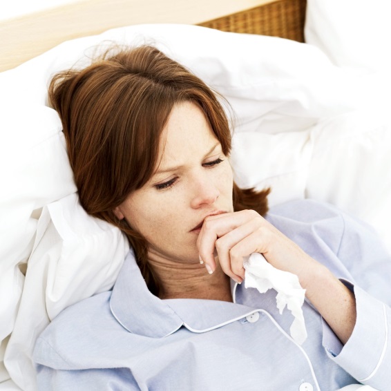 woman sick and in bed