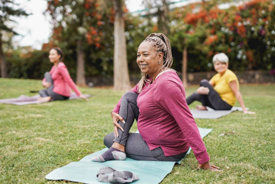 elderly people doing yoga