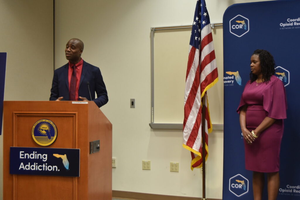 State Surgeon General Dr. Joseph Ladapo at podium