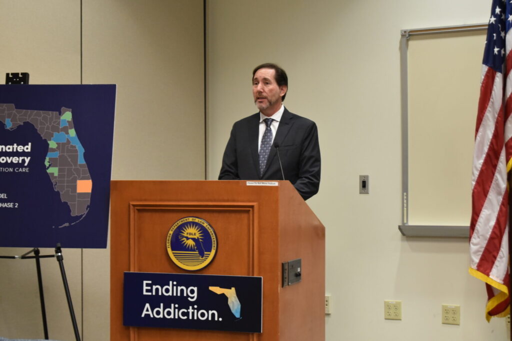 Deputy Secretary for Health Dr. Kenneth Scheppke at podium