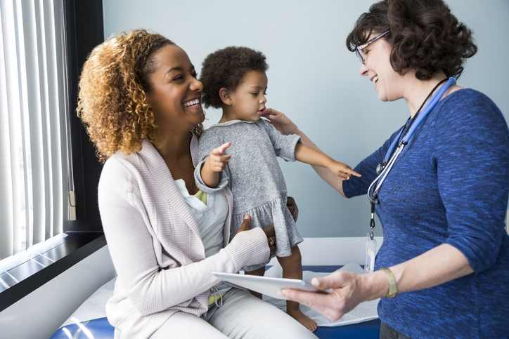 Child being seen by a health care provider