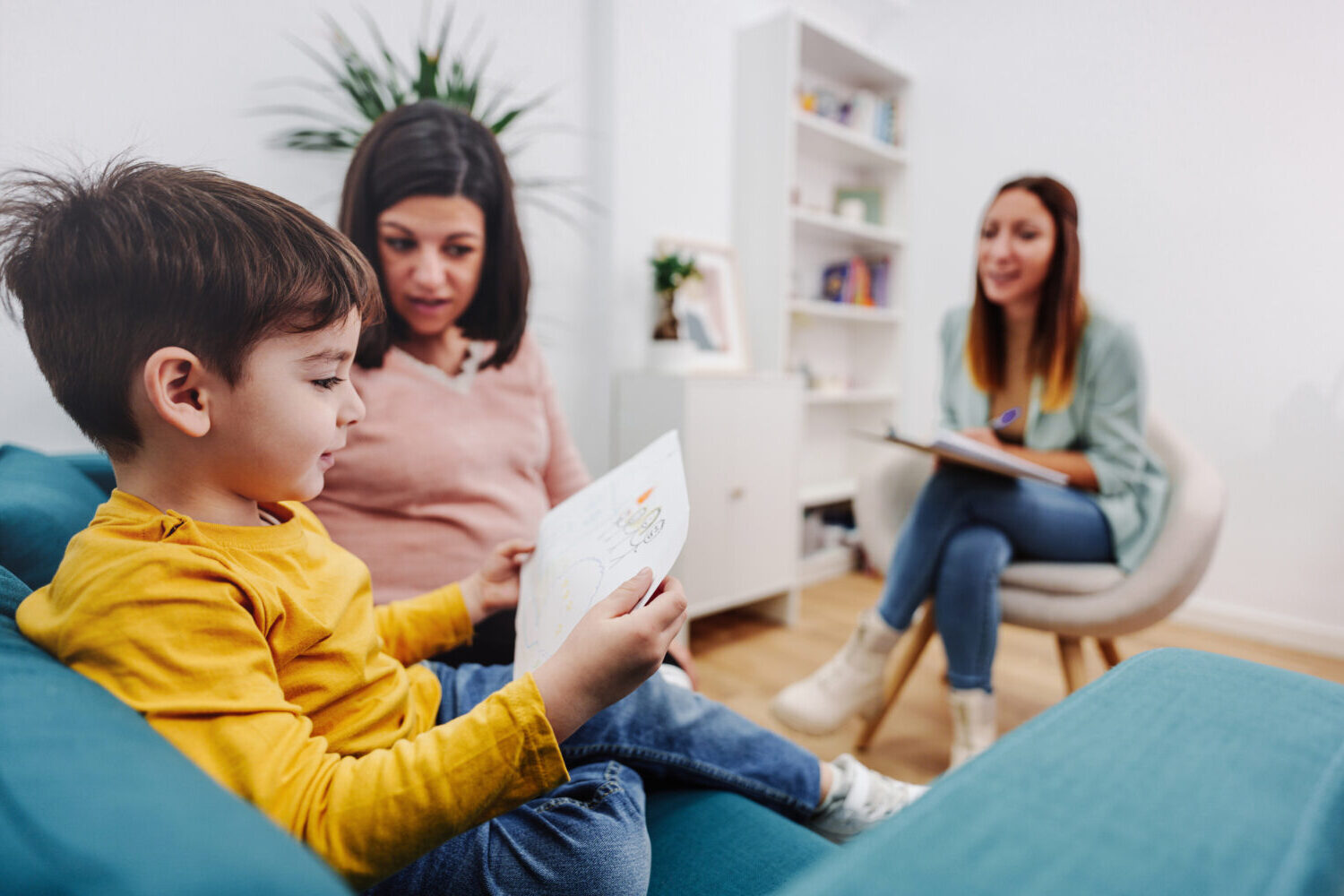 Parent and young child meeting with a behavioral health care provider