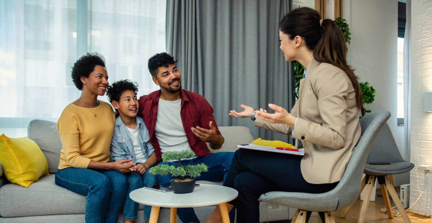 Family talking with professional at home